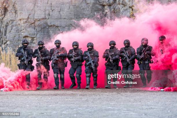 swat police officers shooting with firearm - swat team stock pictures, royalty-free photos & images