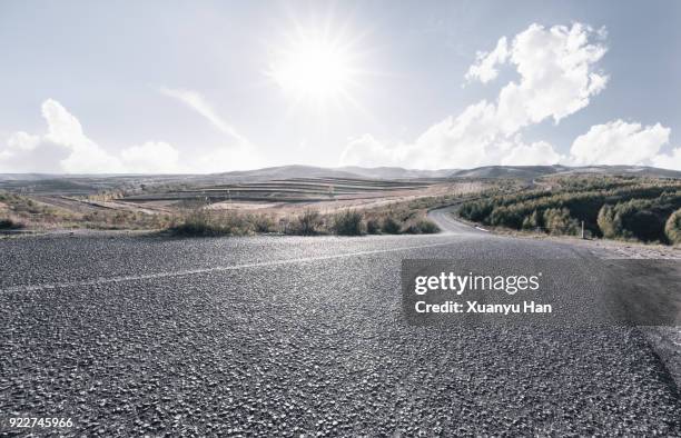 a long open road stretching out far away into the distance - low angle view ストックフォトと画像