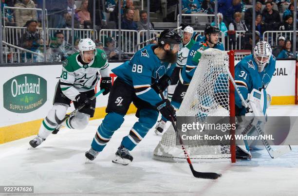 Brent Burns of the San Jose Sharks controls the puck gainst Tyler Pitlick of the Dallas Stars at SAP Center on February 18, 2018 in San Jose,...