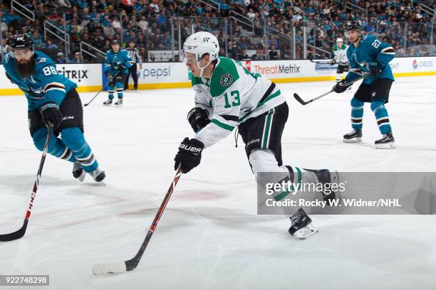 Mattias Janmark of the Dallas Stars skates with the puck against Brent Burns of the San Jose Sharks at SAP Center on February 18, 2018 in San Jose,...