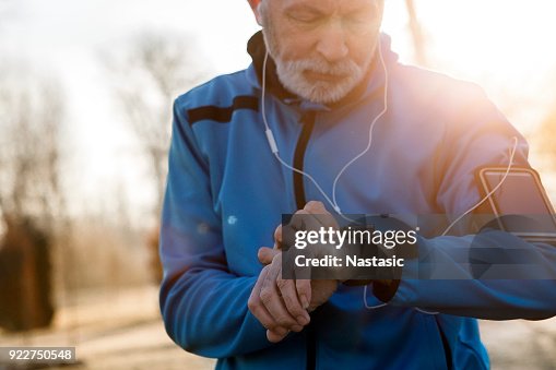 Senior Man using Smart Watch measuring heart rate Senior Man using Smart Watch measuring heart rate