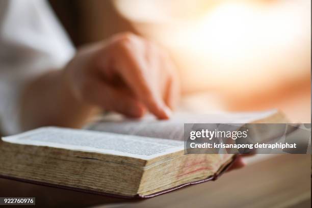 women reading the holy bible.,reading abook. - open bible stock pictures, royalty-free photos & images