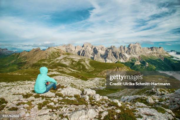 woman overlooking alpine scenery in dolomites / south tyrol / italy - catinaccio rosengarten stock pictures, royalty-free photos & images