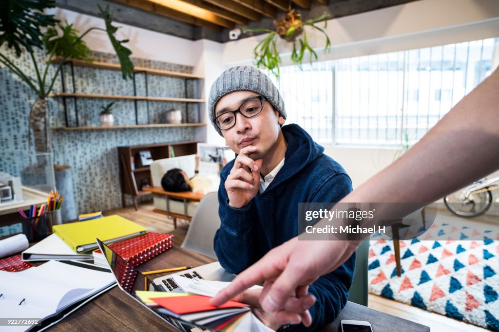 Startup colleagues discussing in meeting