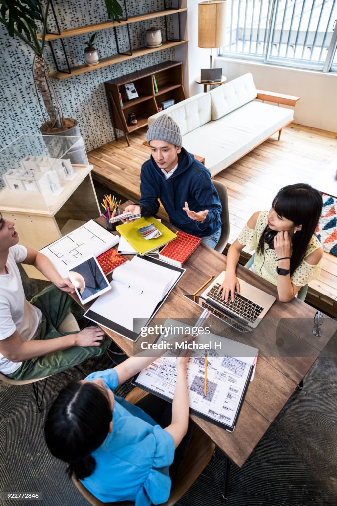 Startup colleagues discussing in meeting