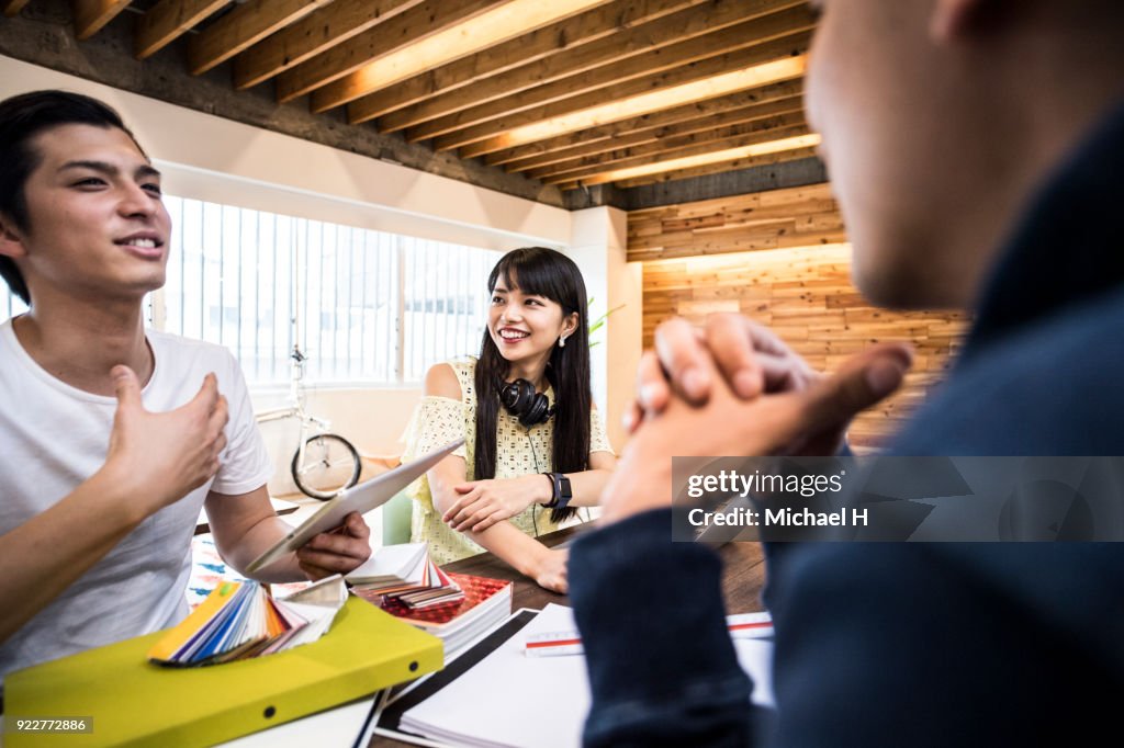 Creative businessman explaining to coworker close-up