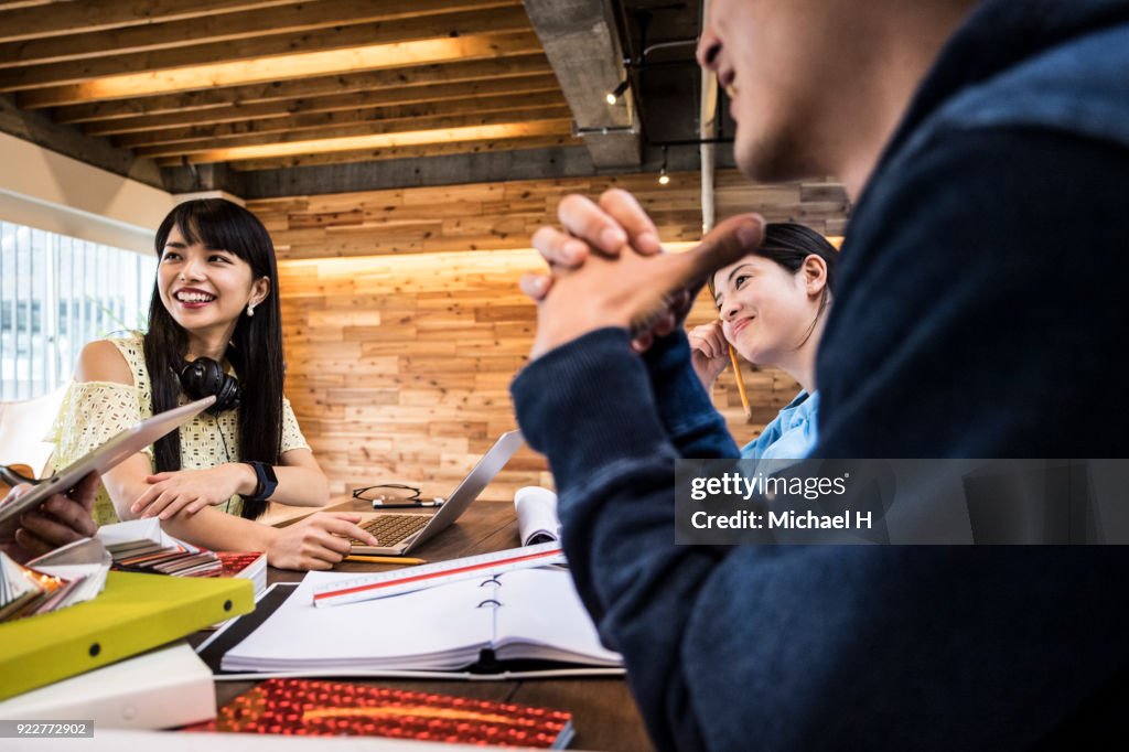 Creative businessman explaining to coworker close-up