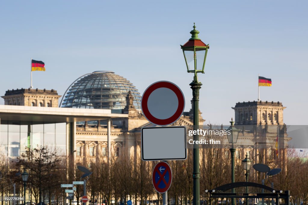 Reichstag building with road signs (German parliament building) - Berlin, Germany