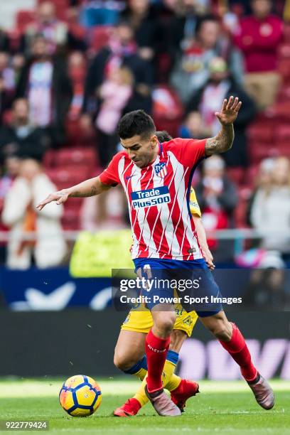 Angel Correa of Atletico de Madrid battles for the ball with Jairo Samperio Bustara of UD Las Palmas during the La Liga 2017-18 match between...