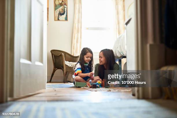 mother playing with daughter - sweet little models stock pictures, royalty-free photos & images