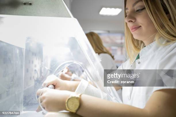 dental technician making dental prosthesis - crown moulding stock pictures, royalty-free photos & images