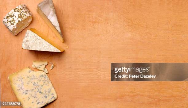 wooden cheese board with copy space - cheese plate stock pictures, royalty-free photos & images