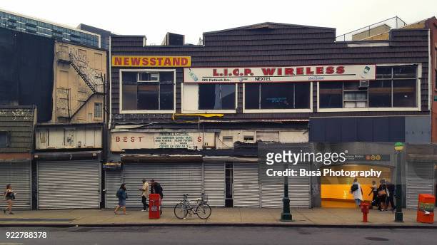 shut-down storefronts and empty vacant retail along flatbush avenue in downtown brooklyn, new york city - vacant or engaged sign stock pictures, royalty-free photos & images