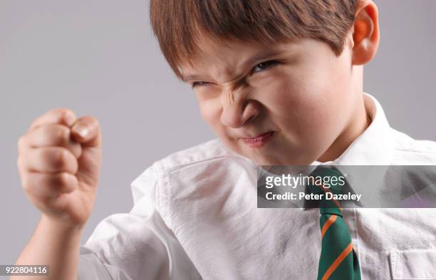 angry schoolboy lashing out - cruel stock pictures, royalty-free photos & images