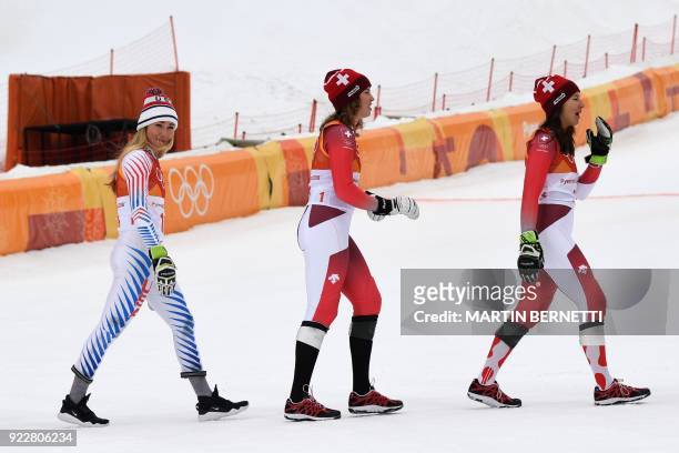 S Mikaela Shiffrin , silver, Switzerland's Michelle Gisin, gold, and Switzerland's Wendy Holdener, bronze, celebrate during the victory ceremony of...