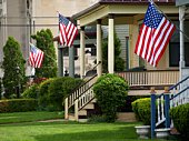 American flags flying from front porches