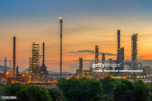 oil and gas refineries at twilight - petrochemical - refine stock pictures, royalty-free photos & images