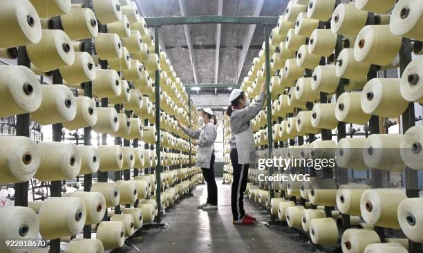 Textile worker spins at a factory on February 22, 2018 in Zibo, Shandong Province of China. It is the first working day after a week-long spring...