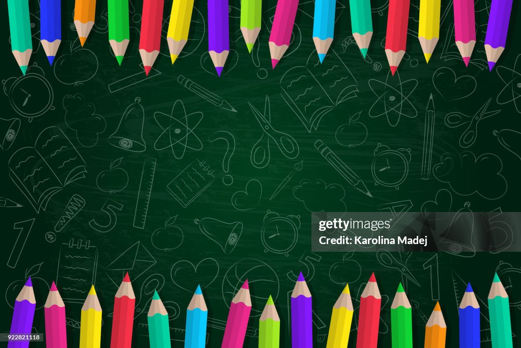 Concept of a school background with coloured pencils and cute doodles. Vector.