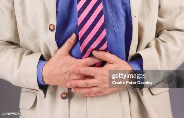 man with stomach pain - gastric ulcer stock pictures, royalty-free photos & images