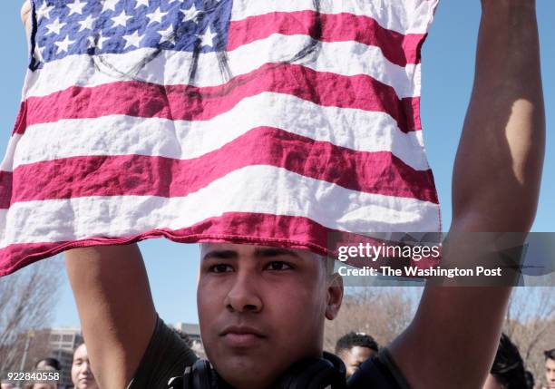 Jabel Sallah, a junior a Richard Montgomery High School joins a student rally in front of the White House in Washington, DC on February 21, 2018. The...