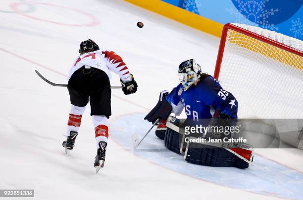 Marie-Philip Poulin of Canada shoot is saved by goalkeeper of USA Maddie Rooney during penalty-shot shootout of the Women's Ice Hockey Gold Medal...