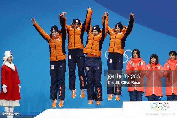 Silver medalists Marrit Leenstra, Lotte Van Beek, Ireen Wust and Antoinette De Jong of the Netherlands celebrate during the medal ceremony for Speed...