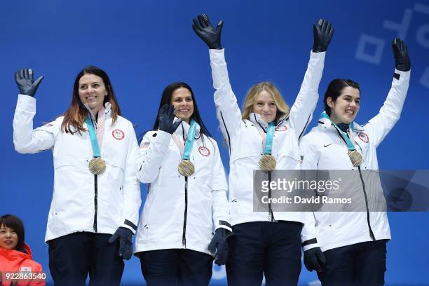 Bronze medalists Heather Bergsma, Brittany Bowe, Mia Manganello and Carlijn Schoutens of the United States celebrate during the medal ceremony for...