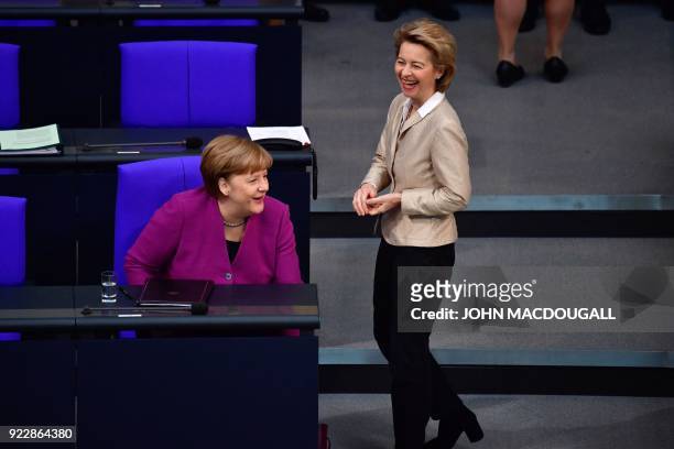 German Chancellor Angela Merkel shares a smile with German Defence Minister Ursula von der Leyen during a session at the Bundestag on February 22,...