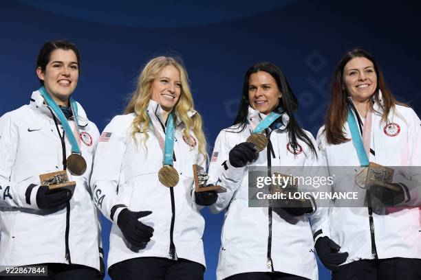 S bronze medallists Heather Bergsma, Brittany Bowe, Mia Manganello and Carlijn Schoutens pose on the podium during the medal ceremony for the speed...