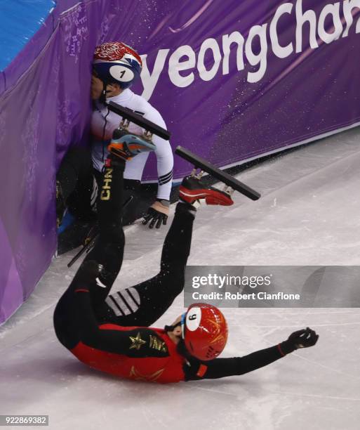 Yira Seo of Korea and Tianyu Han of China fall during their Men's 500m Short Track Speed Skating Quarter Final on day thirteen of the PyeongChang...