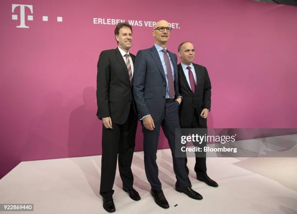 Thomas Dannenfeldt, chief financial officer of Deutsche Telekom AG, left, Tim Hoettges, chief executive officer of Deutsche Telekom AG, center, and...