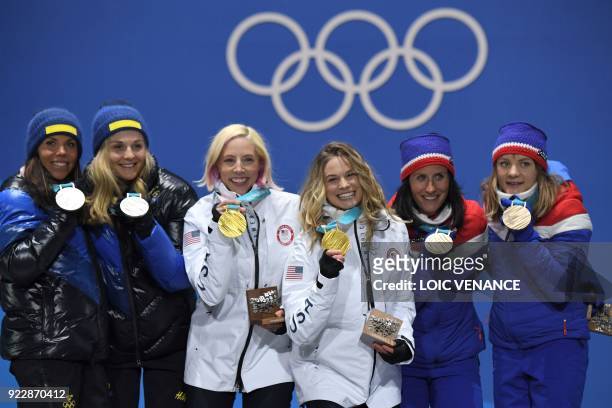 Sweden's silver medallists Charlotte Kalla and Stina Nilsson, USA's gold medallists Kikkan Randall and Jessica Diggins, and Norway's Marit Bjoergen...