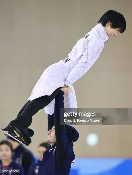 Pyeongchang Winter Olympic gold medalist Yuzuru Hanyu of Japan is lifted by a fellow figure skater during practice in Gangneung, South Korea, on Feb....