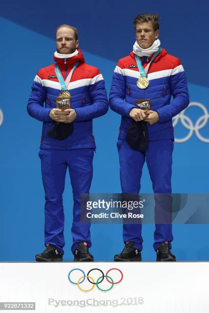 Gold medalists Martin Johnsrud Sundby and Johannes Hoesflot Klaebo of Norway celebrate during the medal ceremony for Cross-Country Skiing - Men's...