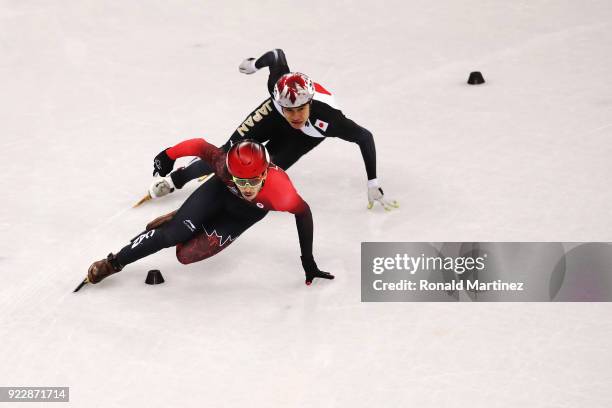 Samuel Girard of Canada and Ryosuke Sakazume of Japan skate during their Men's 500m Short Track Speed Skating Quarter Final on day thirteen of the...