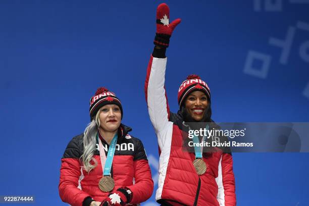 Bronze medalists Kaillie Humphries and Phylicia George of Canada celebrate during the medal ceremony for Bobsleigh - Women on day 13 of the...
