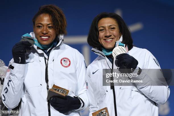 Silver medalists Lauren Gibbs and Elana Meyers Taylor of the United States celebrate during the medal ceremony for Bobsleigh - Women on day 13 of the...