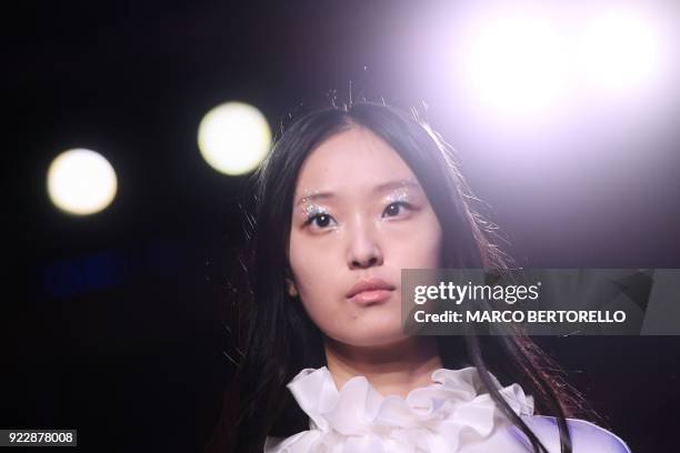 Model presents a creation by Genny during the women's Fall/Winter 2018/2019 collection fashion show in Milan, on February 22, 2018. / AFP PHOTO /...