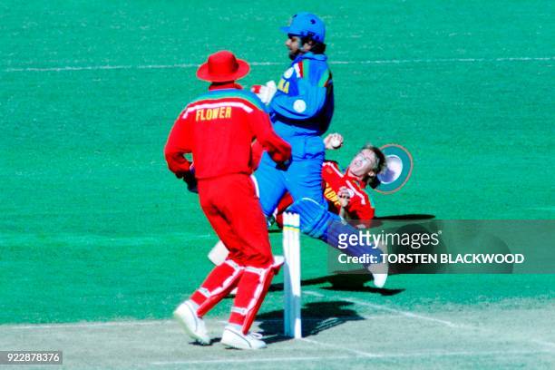 Zimbabwe's Wayne James falls to the ground whilst trying to run out Sri Lanka's Arjuna Ranatunga during the World Cup Cricket match between Zimbabwe...