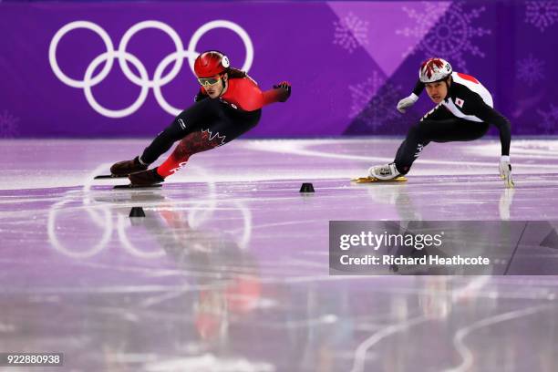 Samuel Girard of Canada and Ryosuke Sakazume of Japan skate in their Men's 500m Short Track Speed Skating Quarter Final on day thirteen of the...