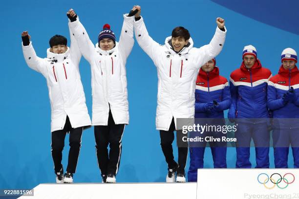 Silver medalists Seung-Hoon Lee, Jaewon Chung, Min Seok Kim of Korea celebrate during the medal ceremony for Speed Skating - Men's Team Pursuit on...