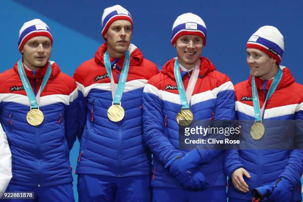 Gold medalists Havard Bokko, Sindre Henriksen, Simen Spieler Nilsen and Sverre Lunde Pedersen of Norway celebrate during the medal ceremony for Speed...