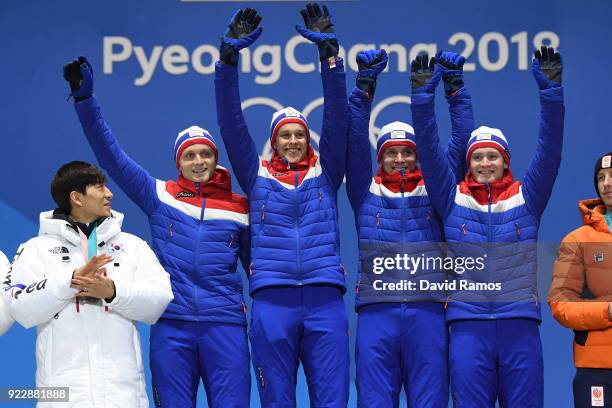 Gold medalists Havard Bokko, Sindre Henriksen, Simen Spieler Nilsen and Sverre Lunde Pedersen of Norway celebrate during the medal ceremony for Speed...