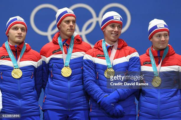 Gold medalists Havard Bokko, Sindre Henriksen, Simen Spieler Nilsen and Sverre Lunde Pedersen of Norway celebrate during the medal ceremony for Speed...