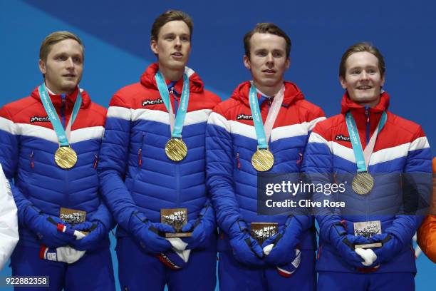 Gold medalists Havard Bokko, Sindre Henriksen, Simen Spieler Nilsen and Sverre Lunde Pedersen of Norway celebrate during the medal ceremony for Speed...