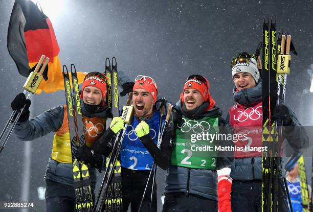 Johannes Rydzek of Germany, Vinzenz Geiger of Germany, Fabian Riessle of Germany and Eric Frenzel of Germany celebrate winning gold during the Nordic...