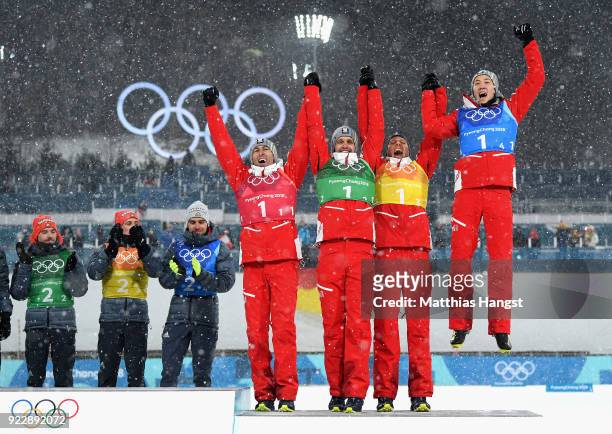 Bronze medalists Wilhelm Denifl of Austria, Lukas Klapfer of Austria, Bernhard Gruber of Austria, Mario Seidl of Austria pose during the victory...