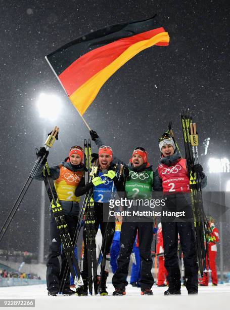 Johannes Rydzek of Germany, Vinzenz Geiger of Germany, Fabian Riessle of Germany and Eric Frenzel of Germany celebrate winning gold during the Nordic...