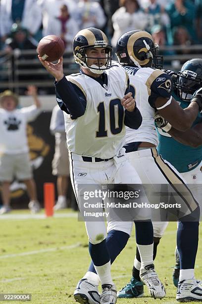 Quarterback Marc Bulger of the St. Louis Rams passes during a NFL game against the Jacksonville Jaguars at Jacksonville Municipal Stadium on October...